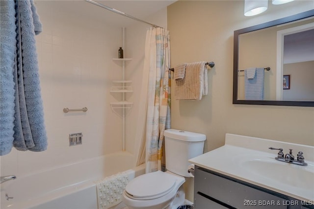 full bathroom with shower / bath combo with shower curtain, toilet, and vanity