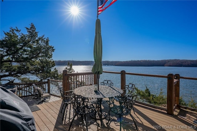 deck featuring a water view