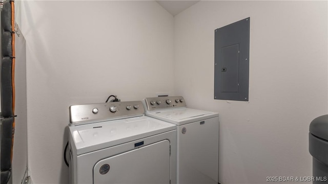 washroom with electric panel and washing machine and clothes dryer