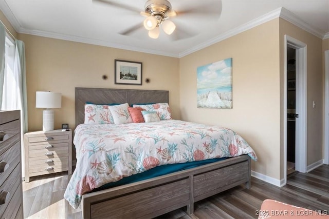 bedroom with ceiling fan, dark hardwood / wood-style flooring, and ornamental molding