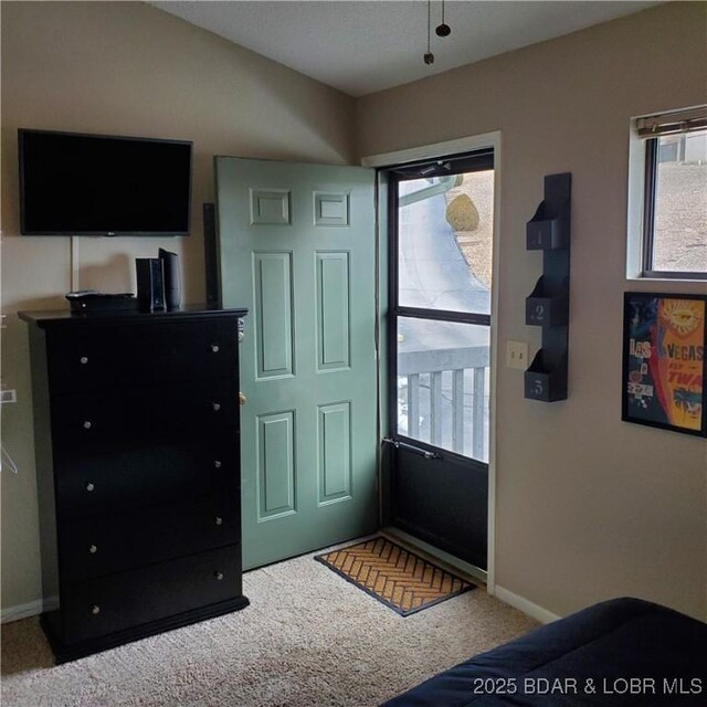 bedroom with carpet flooring and baseboards