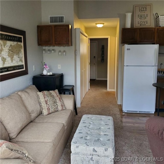 living room featuring visible vents