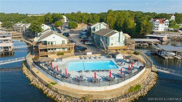 view of swimming pool with a water view