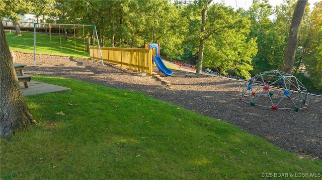 community jungle gym with a yard