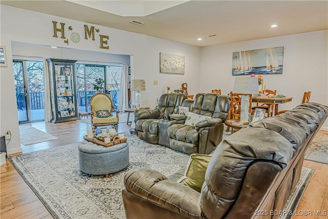 living room with light hardwood / wood-style floors