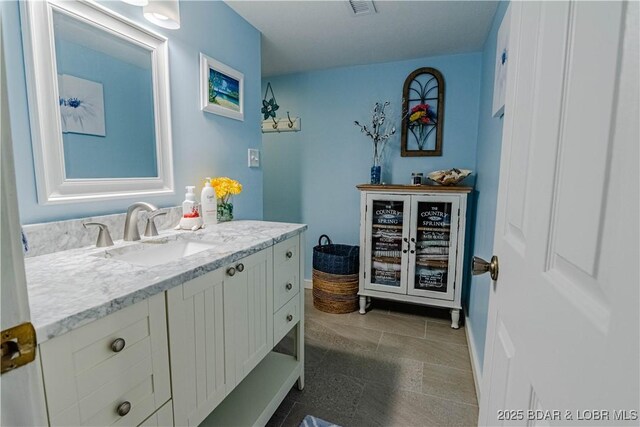 bathroom featuring beverage cooler and vanity