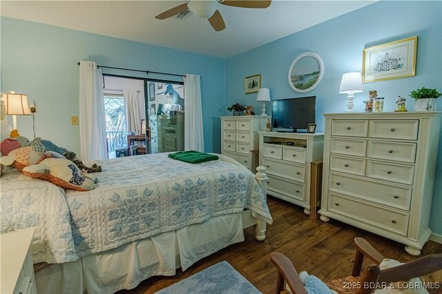 bedroom with dark hardwood / wood-style flooring, ceiling fan, and access to outside