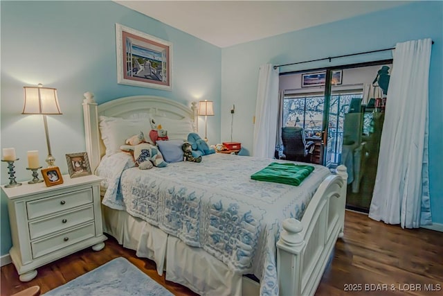 bedroom featuring access to outside and dark wood-type flooring