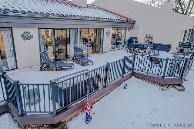 view of snow covered deck