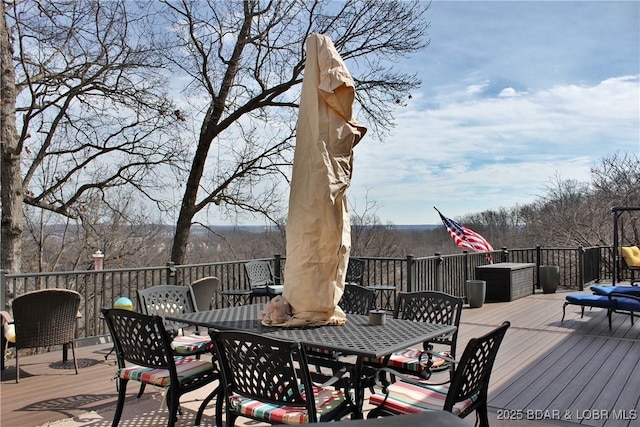 wooden terrace featuring outdoor dining space