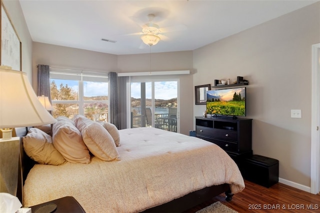 bedroom with ceiling fan, access to outside, and dark hardwood / wood-style flooring