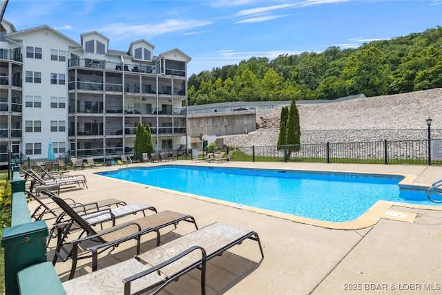 view of swimming pool with a patio area