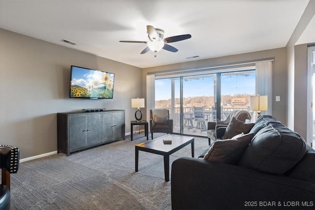 living room featuring carpet floors and ceiling fan