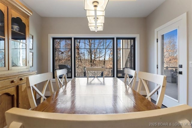 dining space with a notable chandelier