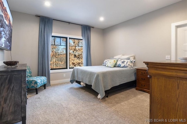 bedroom featuring light carpet