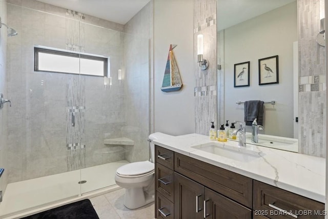 bathroom with tile patterned flooring, toilet, vanity, and walk in shower