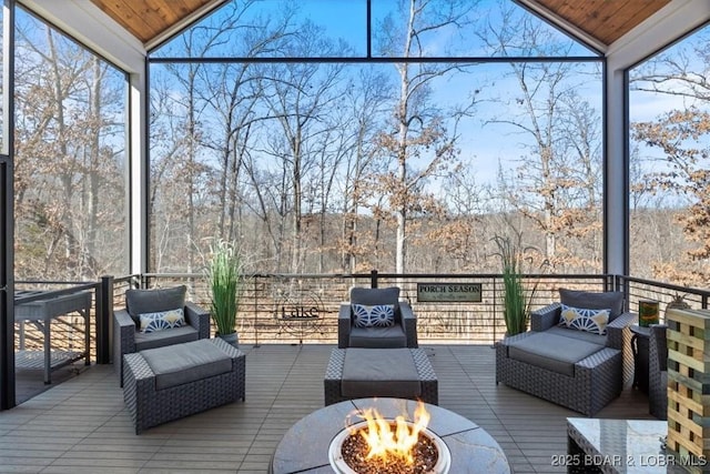 sunroom featuring vaulted ceiling