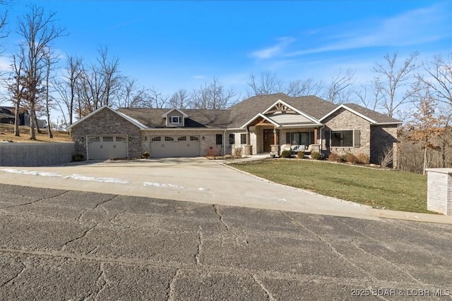 view of front of house with a garage and a front lawn