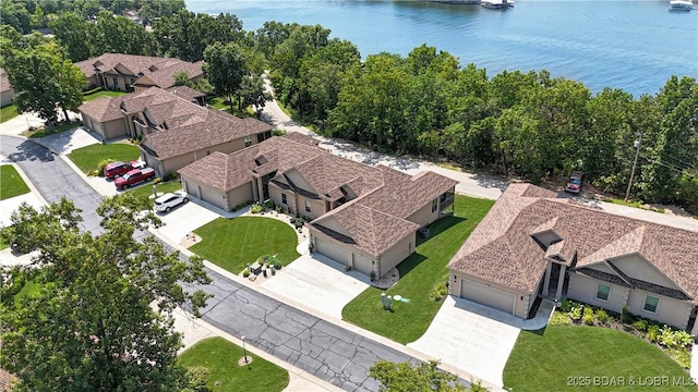 birds eye view of property with a water view