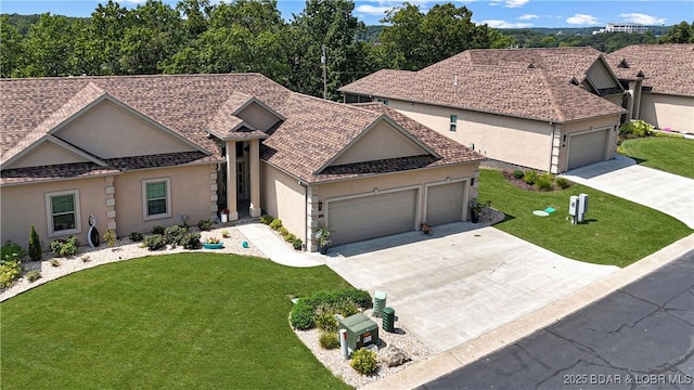 single story home featuring a front yard and a garage