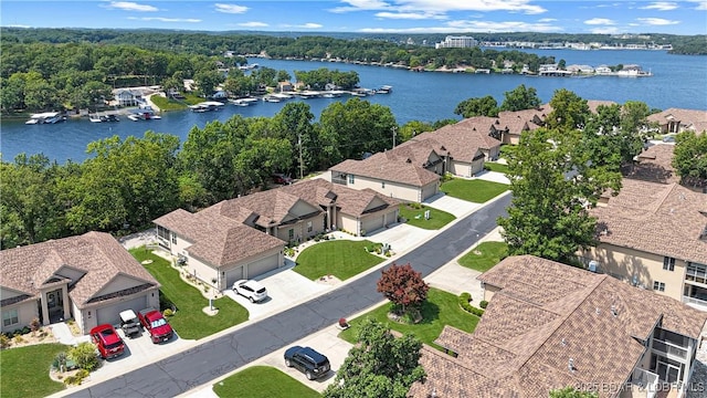 birds eye view of property with a water view