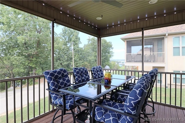 wooden terrace featuring a yard