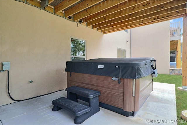 view of patio / terrace featuring a hot tub