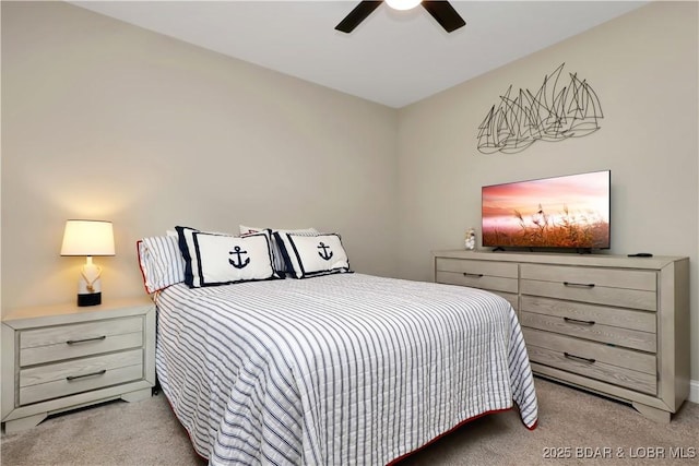 bedroom featuring ceiling fan and light carpet