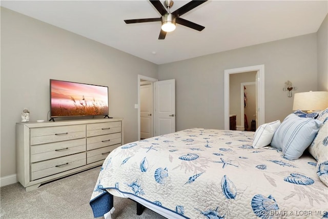 bedroom featuring light colored carpet and ceiling fan