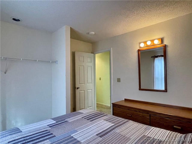 unfurnished bedroom with a textured ceiling