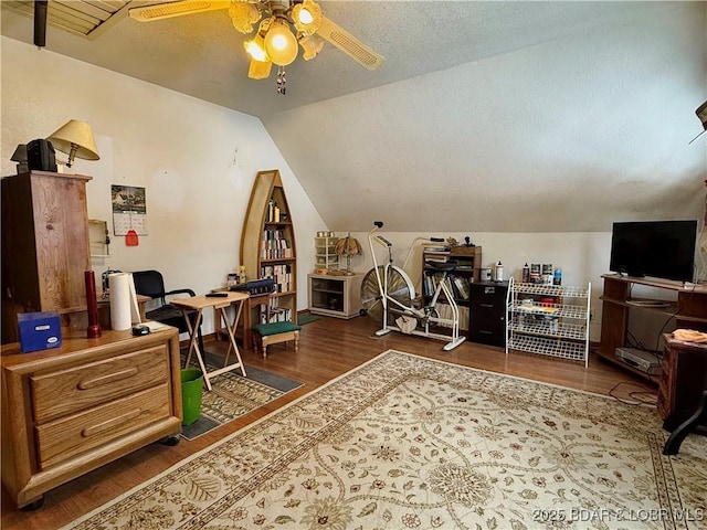 office area with ceiling fan, a textured ceiling, dark hardwood / wood-style floors, and lofted ceiling