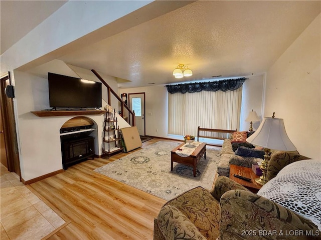 living room featuring hardwood / wood-style flooring and a textured ceiling