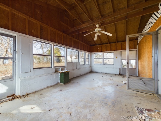 unfurnished sunroom with ceiling fan and lofted ceiling