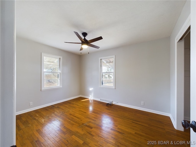 unfurnished bedroom with a closet, ceiling fan, dark hardwood / wood-style flooring, and multiple windows