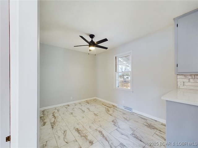 spare room featuring ceiling fan