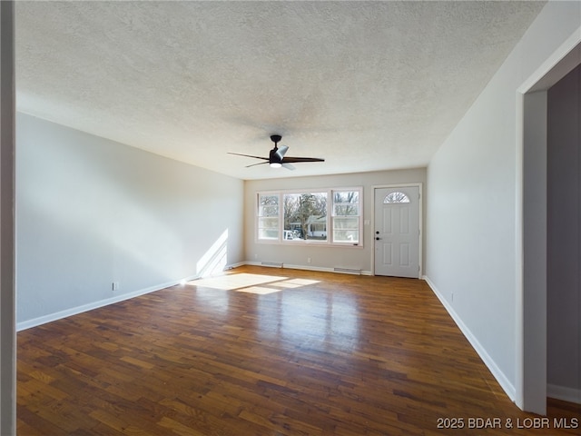 unfurnished room featuring ceiling fan, a textured ceiling, and dark hardwood / wood-style flooring