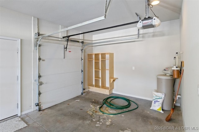 garage featuring water heater and a garage door opener