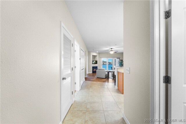 hallway with light tile patterned flooring