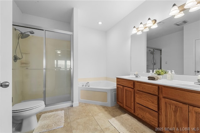 full bathroom featuring vanity, toilet, independent shower and bath, and tile patterned flooring