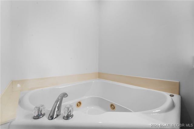 bathroom featuring a tub to relax in