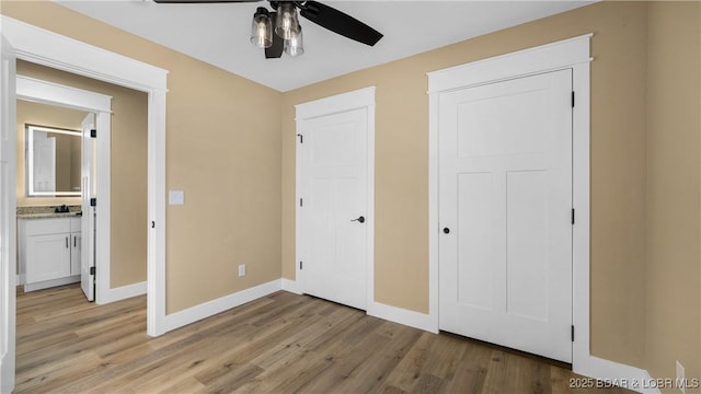 unfurnished bedroom with light hardwood / wood-style floors and ceiling fan