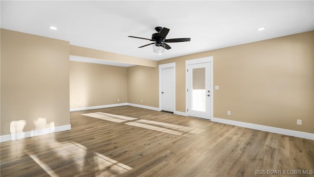 spare room with ceiling fan and hardwood / wood-style floors