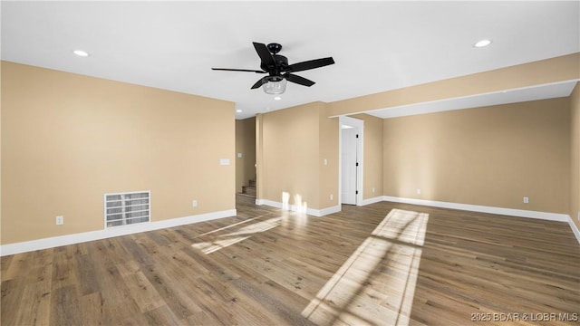20 Simple Time Dr, Camdenton, MO 65020 - empty room featuring a ceiling fan, wood finished floors, recessed lighting, and stairs