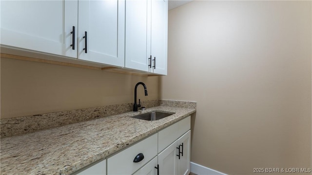 20 Simple Time Dr, Camdenton, MO 65020 - laundry area featuring wet bar and baseboards