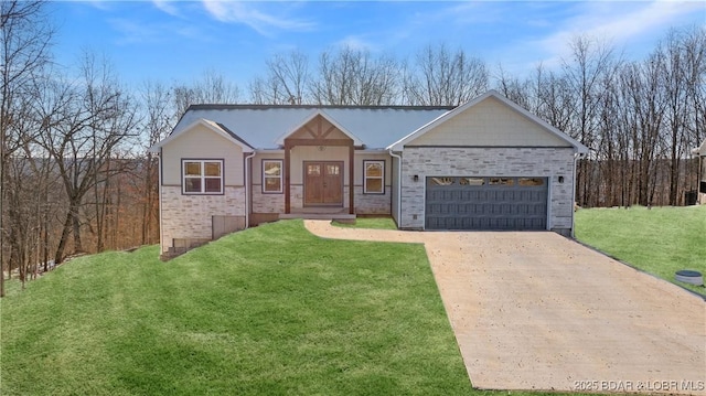 view of front of house featuring a garage and a front lawn