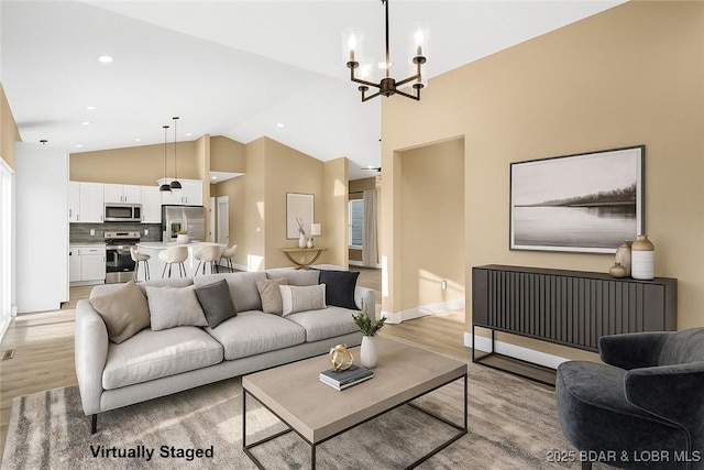 20 Simple Time Dr, Camdenton, MO 65020 - living area with light wood-style flooring, a chandelier, and high vaulted ceiling