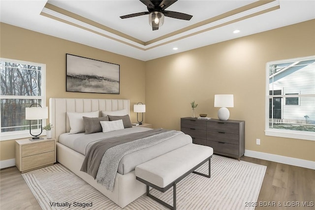 20 Simple Time Dr, Camdenton, MO 65020 - bedroom with a tray ceiling, wood finished floors, recessed lighting, and ceiling fan