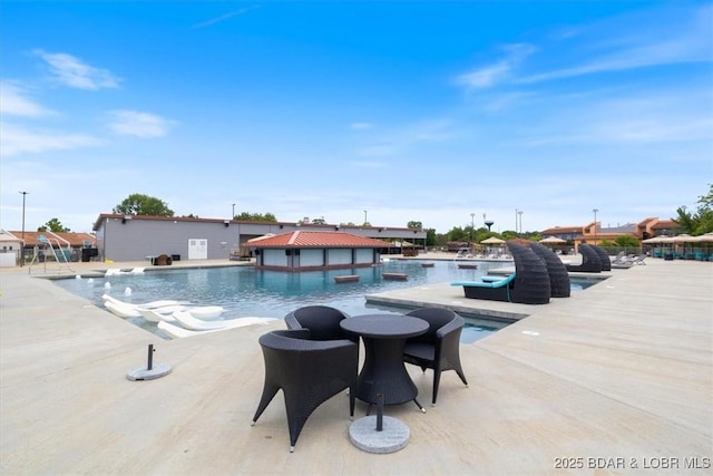 view of swimming pool featuring a patio