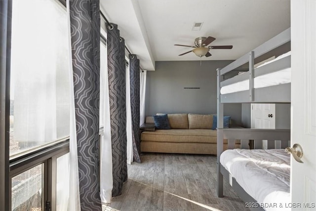 bedroom featuring dark wood-type flooring and ceiling fan