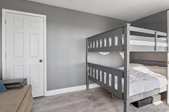 bedroom with hardwood / wood-style floors